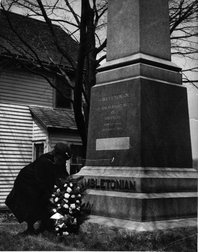 Miss Carrie Houston Durland, granddaughter of Jonas Seely, the breeder of Hambletonian, laying a wreath at the gravesite of Hambletonian on his 100th anniversary. May 5, 1949. CHS-002238